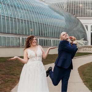 Worn once wedding dress. Minimally altered, just added a bustle. Size 14-16